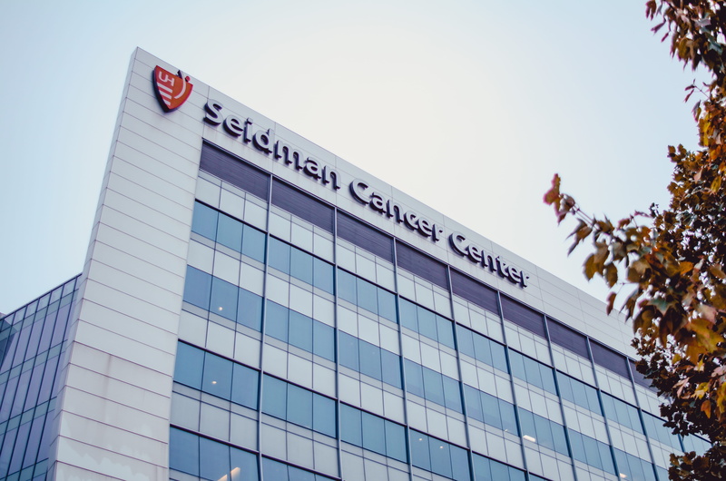 cancer, finance, daytime, offices, healthcare, glass windows, downtown, built structure, clinic, seidman, glass items, city, sign, communication, sky, outdoors