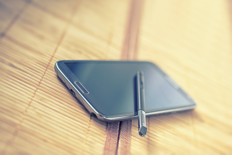 office, high angle view, wood - material, table, close-up, still life, leather, phone, indoors, wood grain, android, smartphone, galaxy, communication