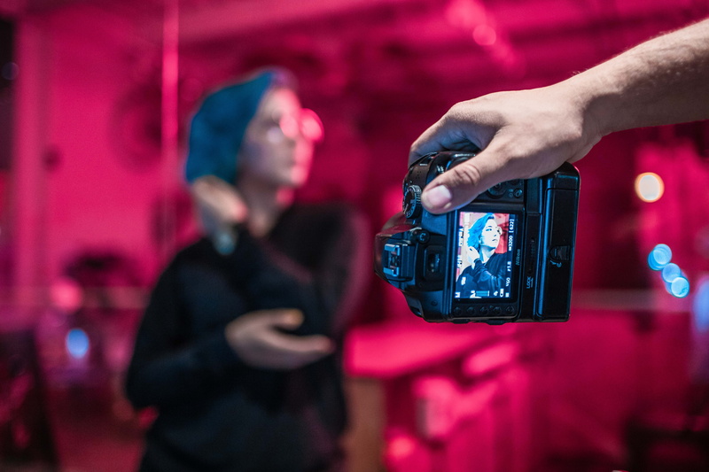 video camera, holding, black, electronics, photography, photo, event, cell phone, human body part, indoors, communication, finger, lcd screen, photography themes