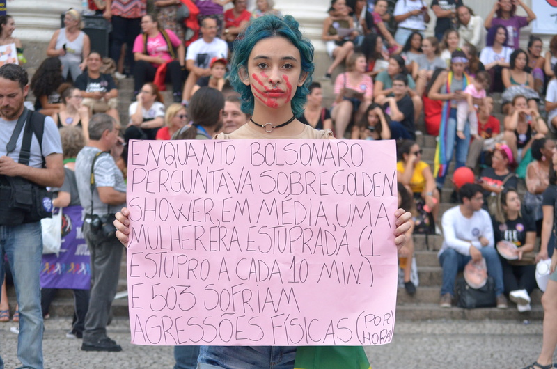 human, parade, looking at camera, bolsonaro, young adult, clothing, western script, portrait, organized group, blue, people, day, footwear, offroad, word