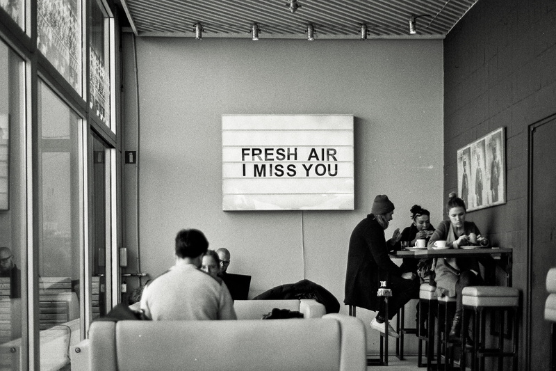 scan, poland, men, bw, message, people, forum przestrzenie, table, women, indoors, black and white, cafe, rear view, kraków, ilford, chair, interion, noir