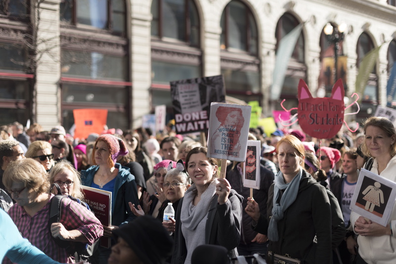 female, holding, building, city, standing, leium, communication, person, built structure, city life, front, adult, sign, architecture, woman, people, marching