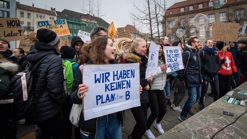 people, warm clothing, architecture, day, built structure, apparel, clothing, climate, human, communication, shoe, germany, footwear, berlin, banner, group of people