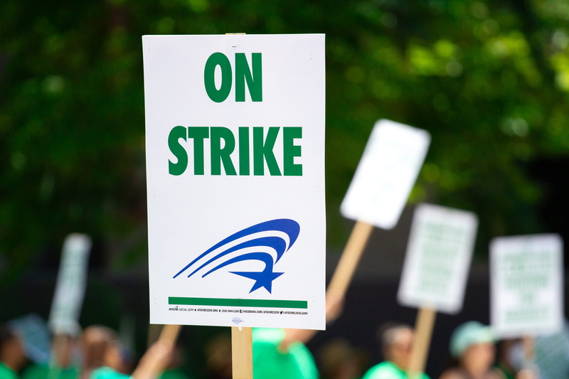 focus on foreground, day, green color, finance, human limb, signage, 5K, strike, western script, message, rallying, blue, road sign, sign, protest, information sign