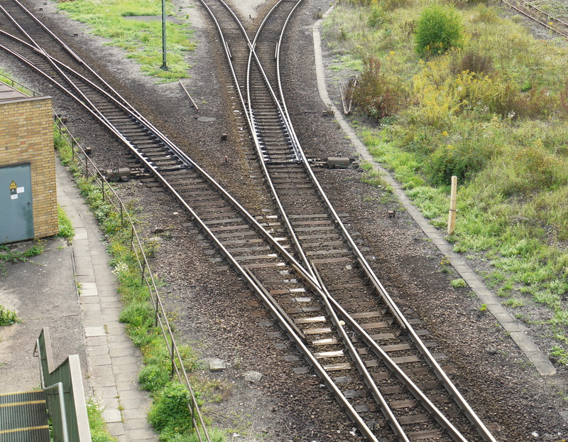 train - vehicle, train, direction, railway, architecture, outdoors, high angle view, connection, railways, seemed, marshalling yard, railway tracks, day