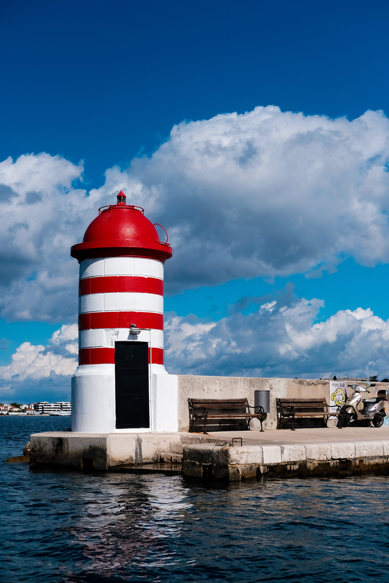 gray, building, sky, sea, blue sky, architecture, guidance, navigation, seascape, landscape, motor, near, no people, nature, waves, red, ocean, protection