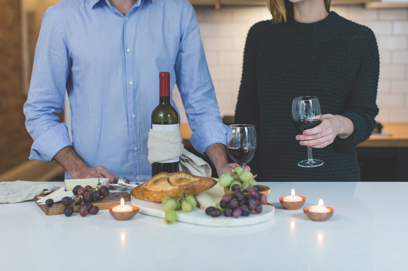 standing, women, glass, wineglass, midsection, wooden, drinks, beside, two people, room, food and drink, couple - relationship, white, wine glasses, men