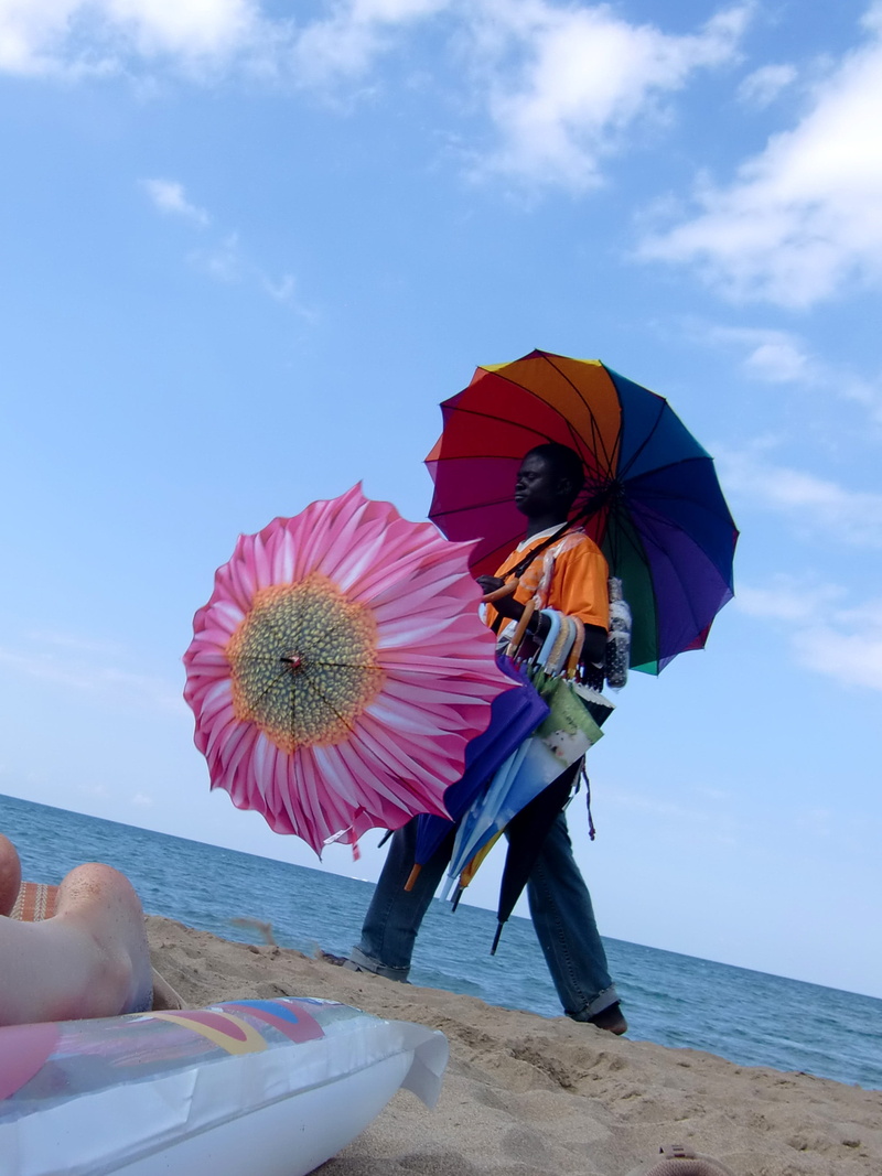 adult, lifestyles, Africans, one person, Dealer, leisure activity, beauty in nature, umbrella, flower, adults only, Seller, women, Beach, protection, nature