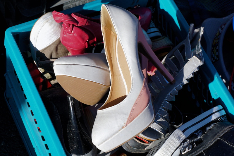 stack, junk, day, security, large group of objects, womens shoes, paragraph, outdoors, high drop off, garbage, transportation, land vehicle, sale, shoe