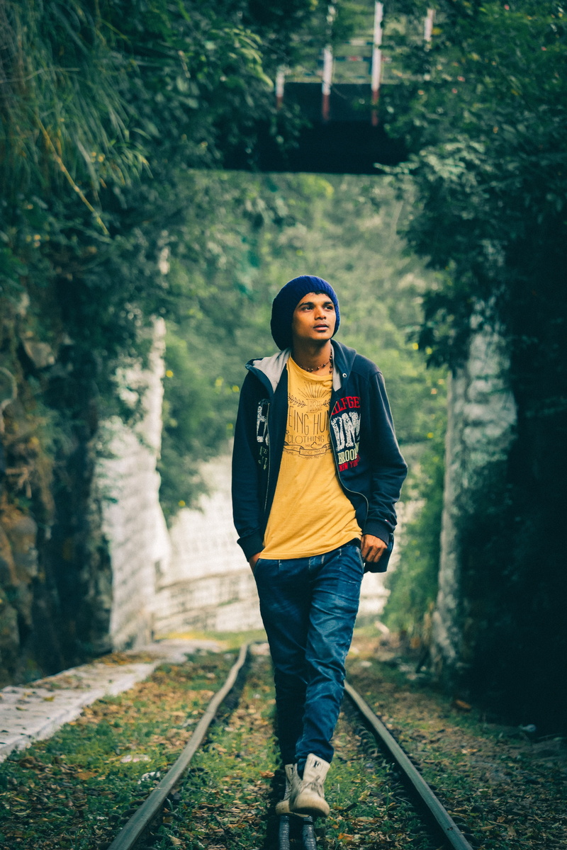india, walking, men, railroad track, outdoors, 5K, full length, standing, track, casual clothing, young adult, tree, leisure activity, solo, plant, lifestyles