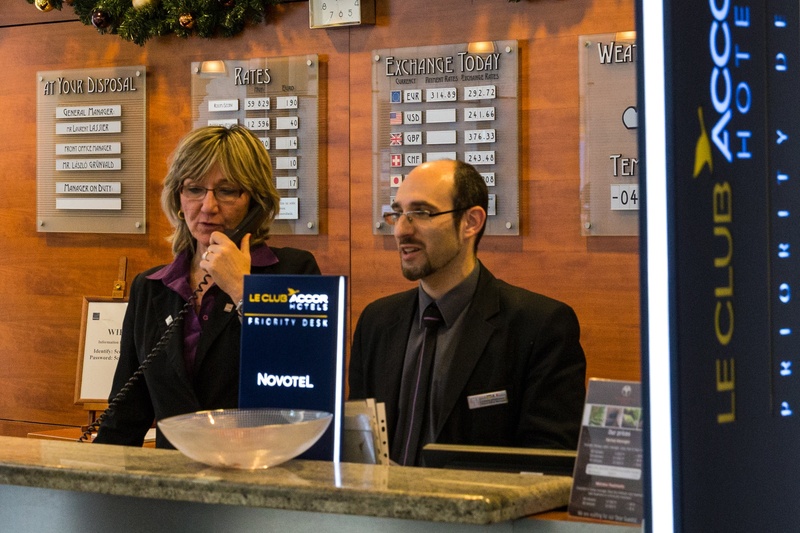 lobby, wireless technology, check-in, hotel, standing, business person, reception, key counter, travel, entrepreneur, woman, leisure, phone, headshot, waist up