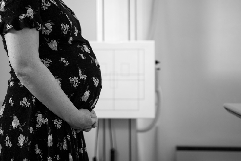 standing, mom, home interior, wall - building feature, pregnant, clinic, one person, hospital, radiology, anticipation, casual clothing, x-ray, person