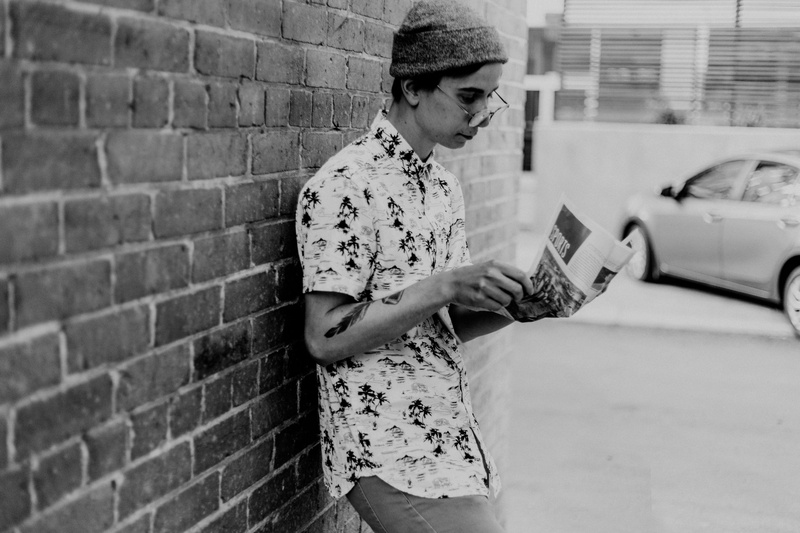 built structure, brick, casual, real people, brick wall, stand, relax, young, news, standing, looking, 5K, youth, leaning, holding, lifestyles, hanging out