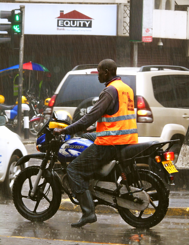 real people, road, mode of transportation, rain, outdoors, men, nairobi, full length, rear view, car, built structure, one person, architecture, kenya