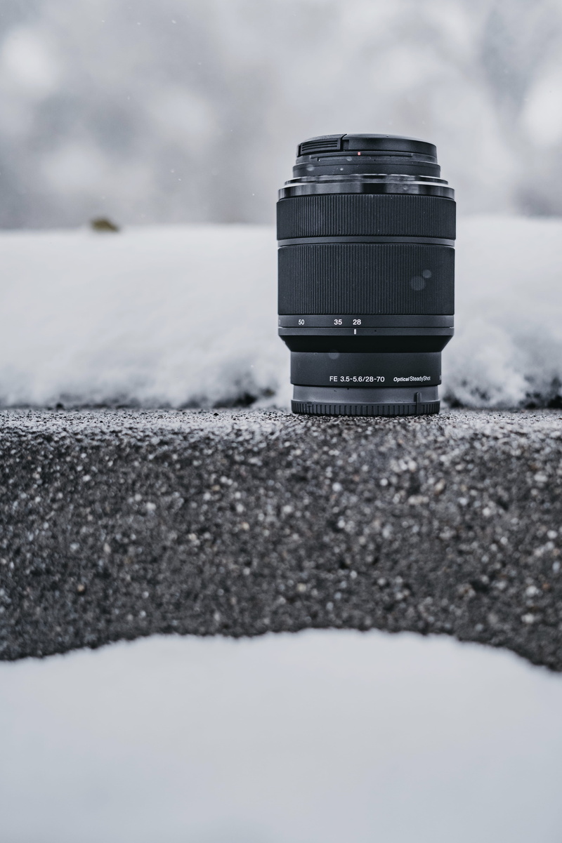 electronics, single object, day, machine, black, camera lens, camera - photographic equipment, cloud - sky, natural light, united states, snowy, photographic equipment