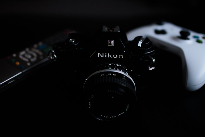 light, symbol, laser, lens - optical instrument, video camera, digital camera, lens cap, black background, music, keyboard, no people, close-up, indoors