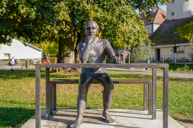 park, sitting, sculpture, 5K, man at the table, outdoors, human representation, culture, full length, people, nature, architecture, upper palatinate, monument