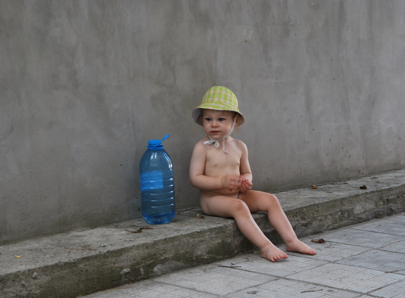 2K, beautiful, boy, background, full length, sitting, cute, shorts, day, real people, drink, holding, water, portrait, shirtless, toddler, offspring, wall - building feature