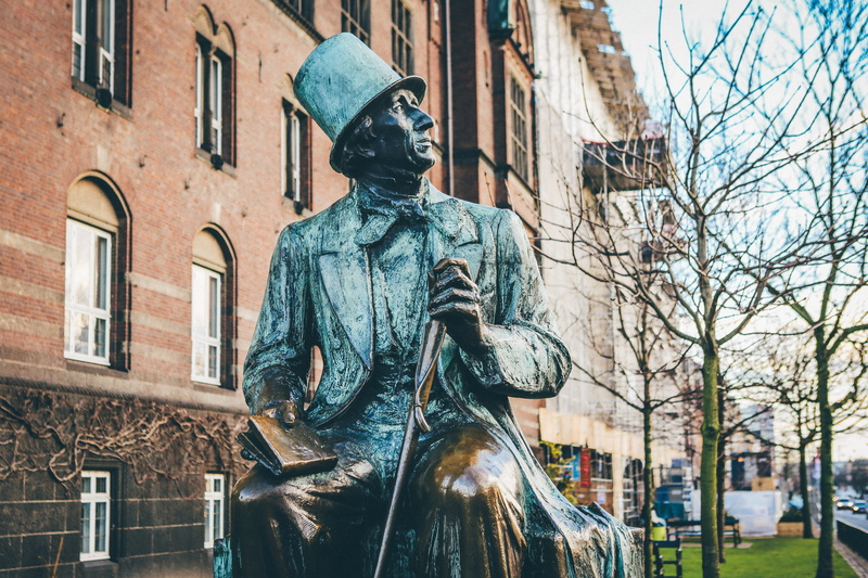 built structure, day, man, 5K, concrete, bare tree, holding, tree, memorial, city, book, hat, human representation, sitting, blue, no people, statue, low angle view