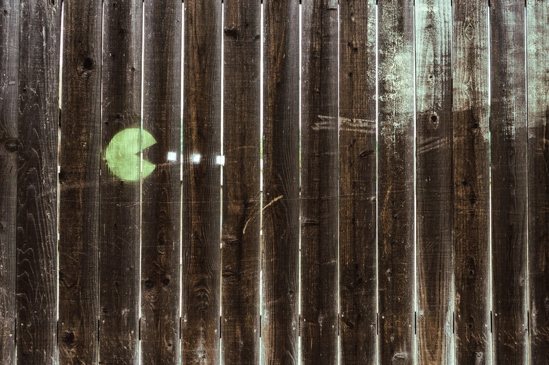 pane, wall - building feature, fence, close-up, sunlight, full frame, boards, wood - material, graffiti, day, hanging, decoration, pattern, planks, motion