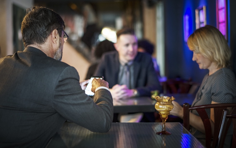 group of people, bar counter, food and drink, bar - drink establishment, blazer, chair, women, blonde hair, mature men, males, glass, blurred background