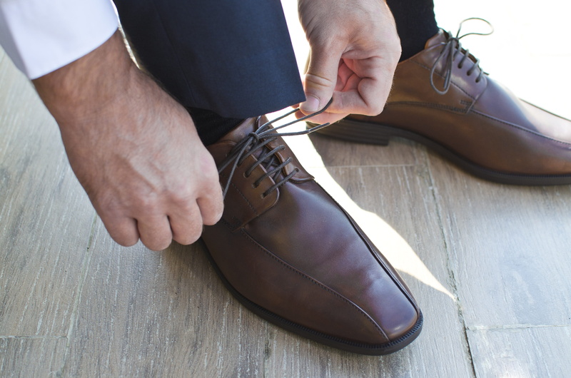 leisure activity, lifestyles, fixing, indoors, shoe, high angle view, commit, men, real people, shoelace, shoes, blue, bootlace, hand, pants, one person