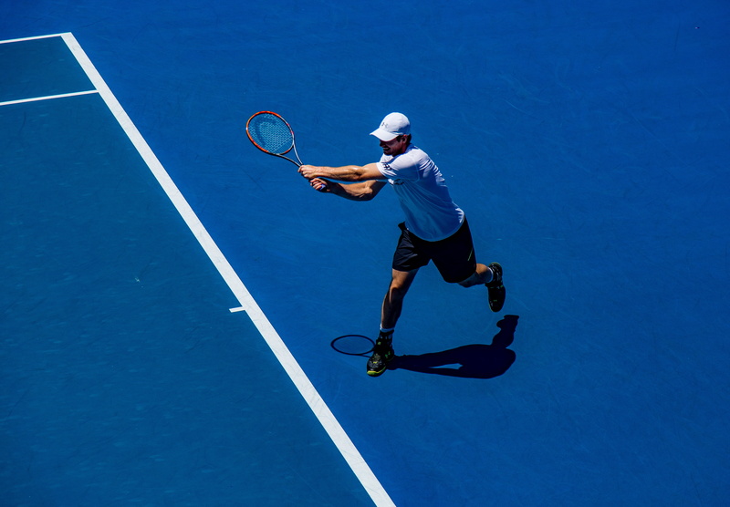 standing, adult, full length, outdoors, field, speed, one person, image Technique, playing, human Age, sport, clothing, racket, competitive Sport, professional sport