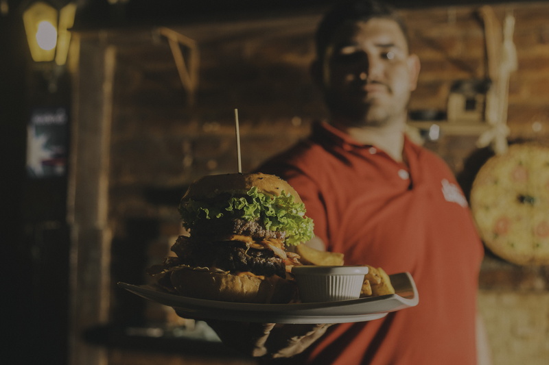 fries, person, young adult, square, wear, man, preparation, occupation, preparing food, lunch, restaurant, freshness, facial expression, furniture, blurred background
