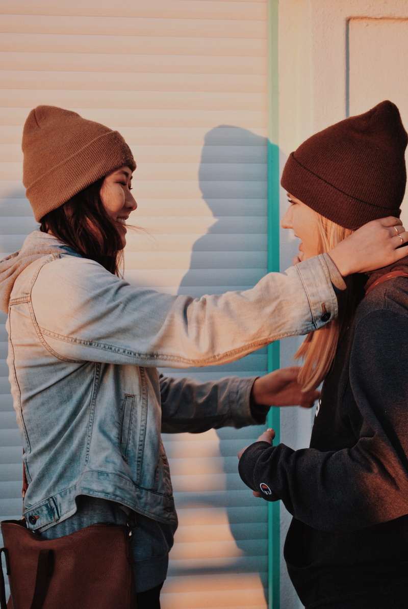 4K, young adult, waist up, railing, hat, touching, standing, men, human, alloy wheel, casual clothing, bonding, smiling, machine, real people, bonnet
