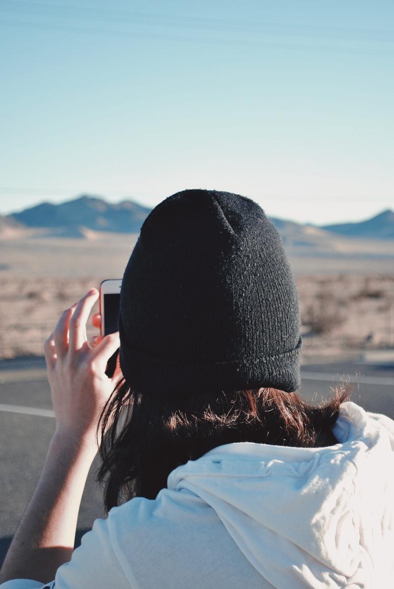 dune, scenics - nature, rear view, one person, cap, face, rock, near, sky, warm clothing, mountain, adult, soil, outdoors, lifestyles, selective, portrait