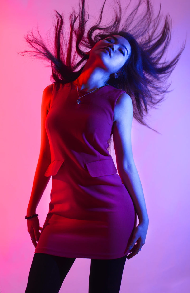young women, motion, colored background, young adult, beautiful woman, woman, upward, women, glamour, hairstyle, purple, hair, tousled hair, adult, wind