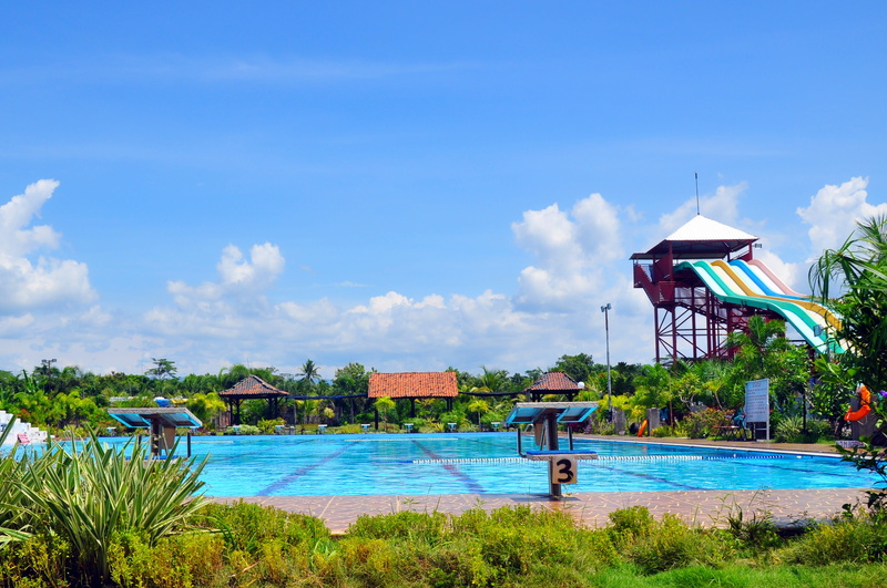 outdoors, Central Java, day, grass, lifestyles, people, cloud - sky, land, nature, beauty in nature, leisure activity, the swimming pool, sky, building exterior