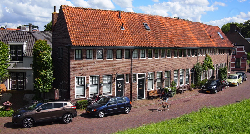 northern europe, motor vehicle, village, roof tile, road, day, car, sunlight, building exterior, urban, incidental people, town, architecture, street, city