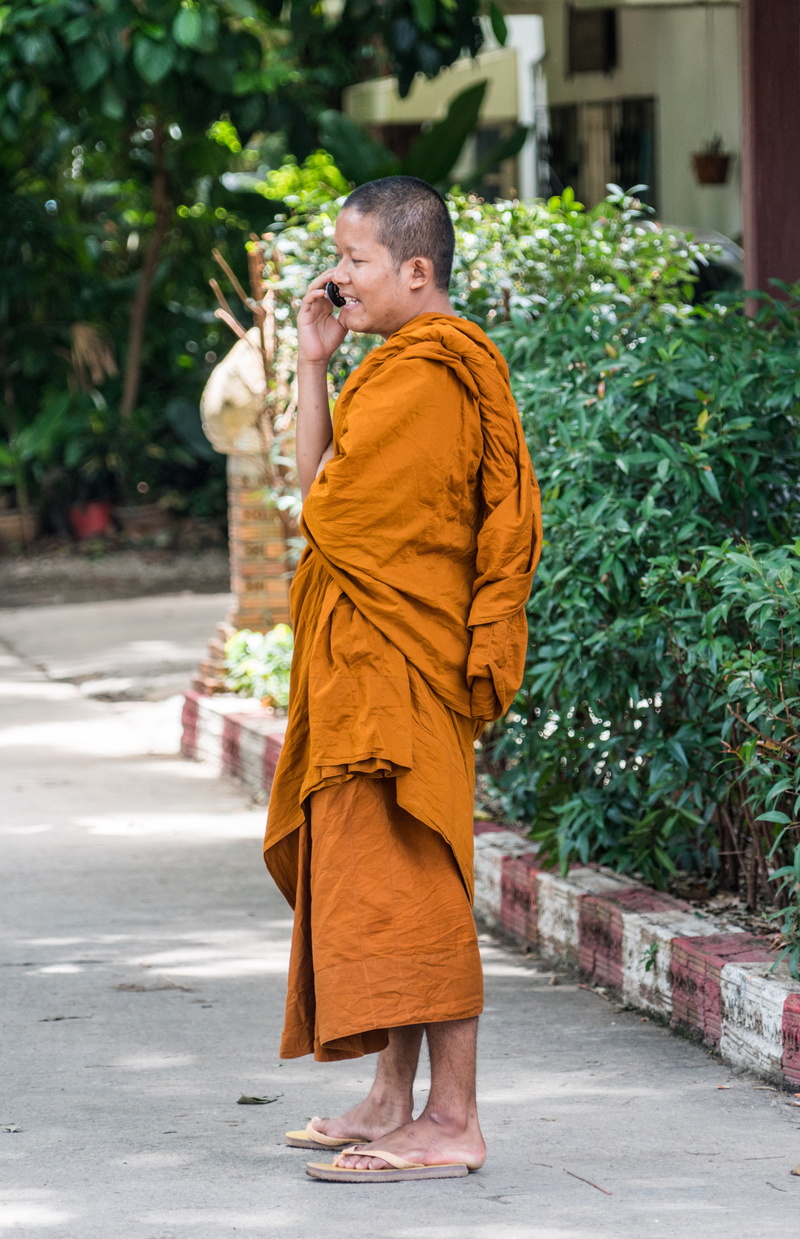 talking, young, holding, real people, monk, robe, traditional clothing, asian, architecture, childhood, person, travel, day, plant, happy, chiang mai, cell phone