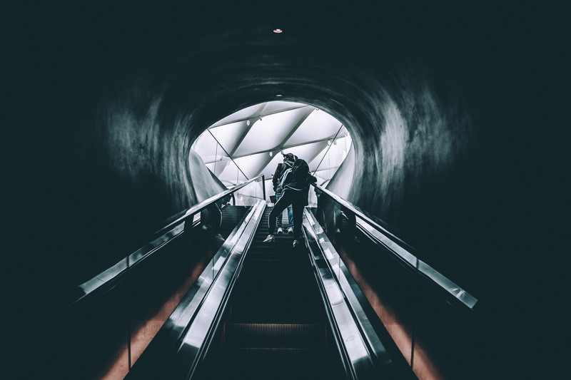 light - Natural Phenomenon, built structure, tunnel, one person, indoors, s, black, black Color, technology, dark, motion, underground, railing, no People