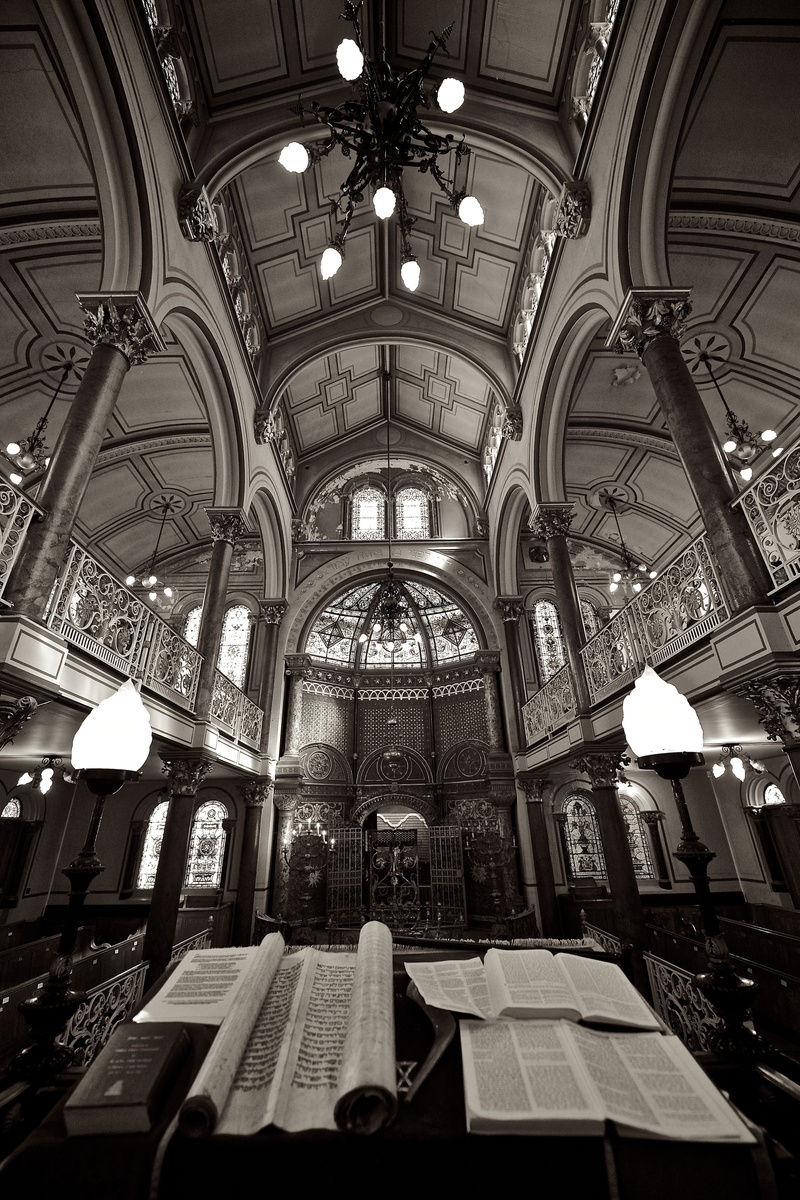 lighting equipment, built structure, table, arch, bible, architecture, no people, religious, indoors, books, monochrome, photography, cathedral, illuminated