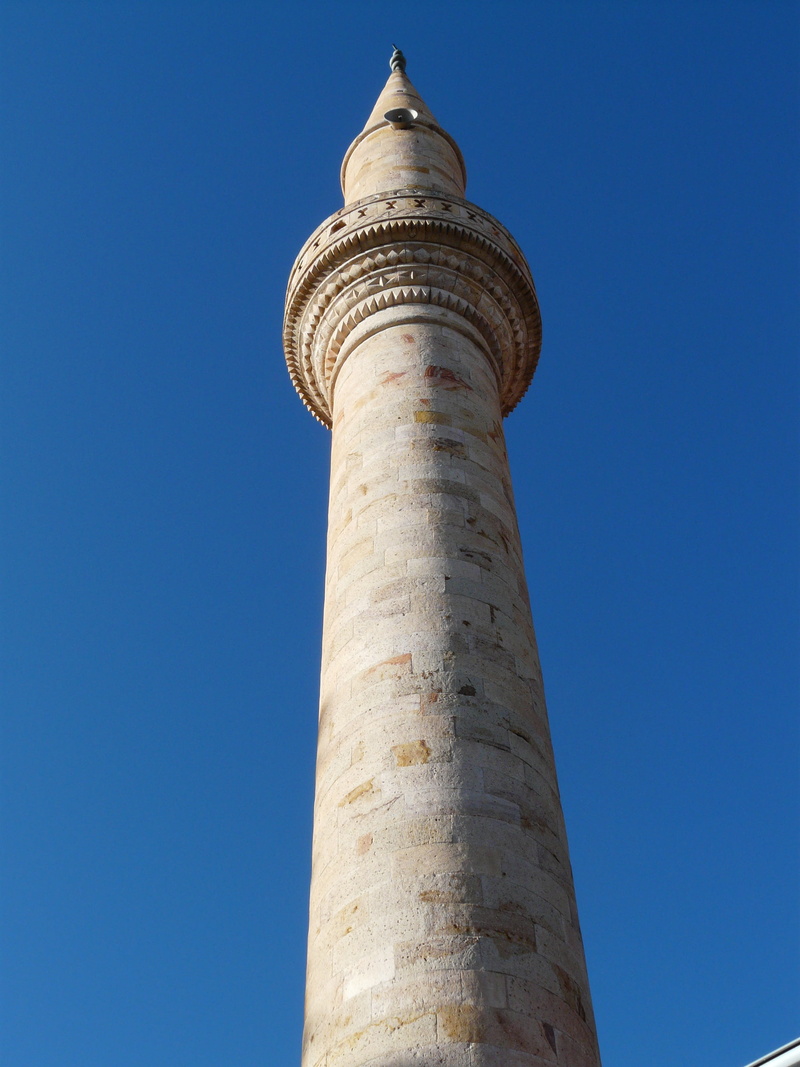 day, islam, low angle view, history, building exterior, mosque, minaret, built structure, faith, religion, city, daytime, tourism, blue, gray, sky, building