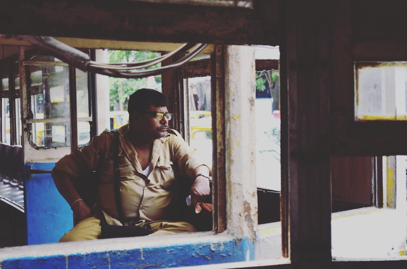 kolkata, young men, one person, window, day, sitting, 1080P, looking, trams, daylife, leisure activity, looking away, casual clothing, clothing, relaxation