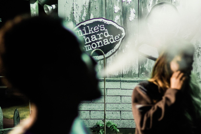 focus on background, smoke, incidental people, over the shoulder view, closeup, selective, photography, blow, text, party, women, 5K, people, person, group of people