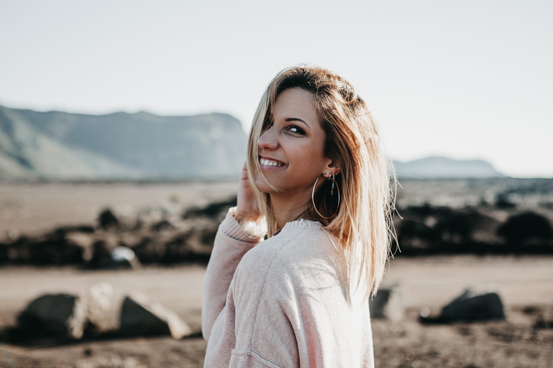 person, land, route du volcan, smile, woman, sweater, smiling, réunion, bliss, beauty, leisure activity, hair, gray, wearing, portrait, beach, hoop earring