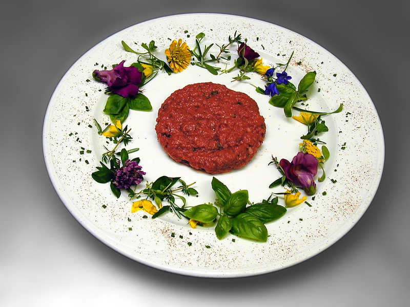 wellbeing, directly above, studio shot, flowers, starter, meat, herb, pepper, plate, menu, menu sequence, still life, minced  meat, black background, freshness