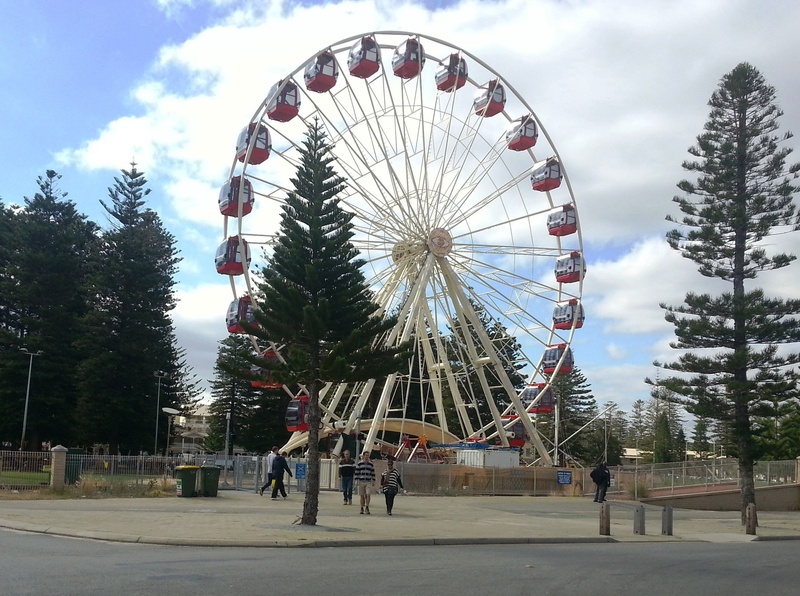 tree, amusement park, amusement park ride, incidental people, cloud - sky, large, arts culture and entertainment, wheel, fairground, real people, western australia