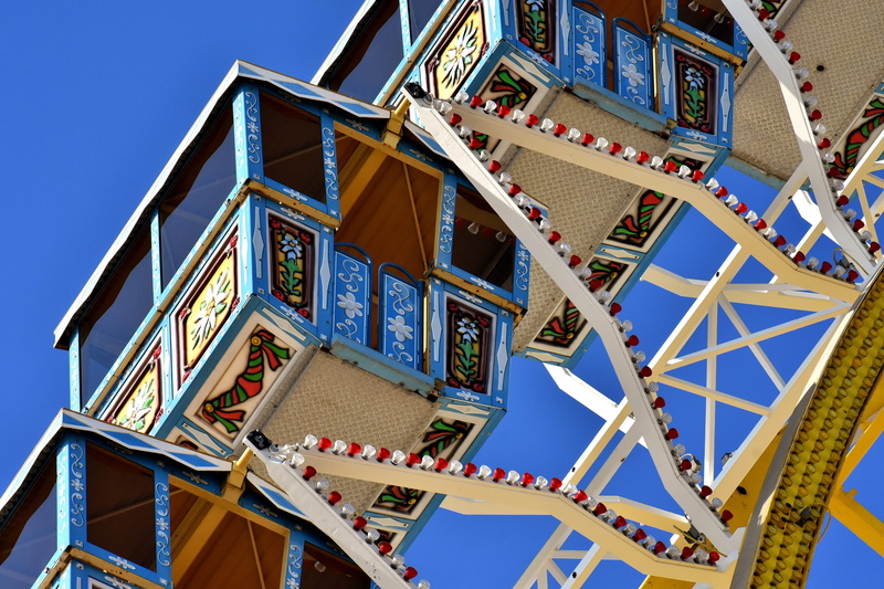 year market, amusement park, carnival, oktoberfest, built structure, ferris wheel, fairground, outdoors, metal, day, photo, low angle view, amusement park ride