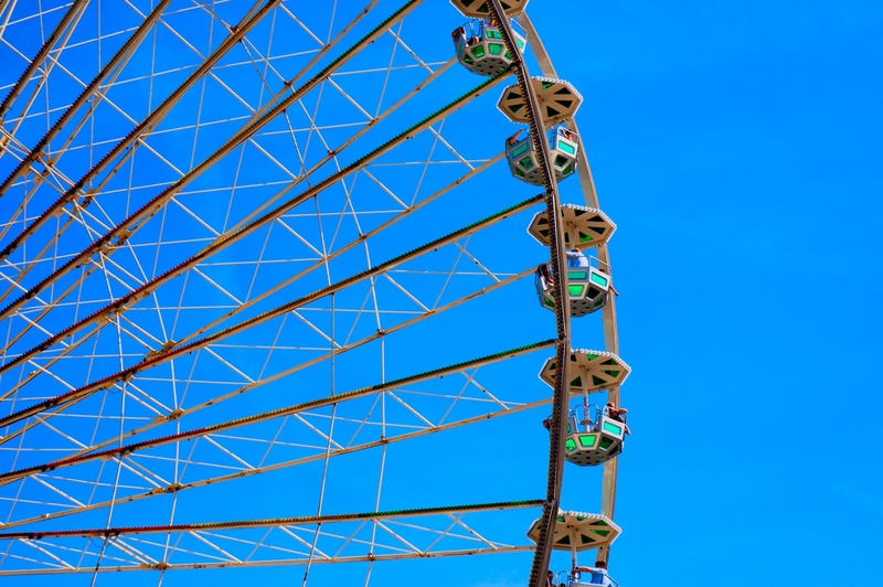 rides, fair, sky, gondolas, ferris wheel, blue, arts culture and entertainment, day, amusement park ride, nature, sunlight, enjoyment, leisure activity