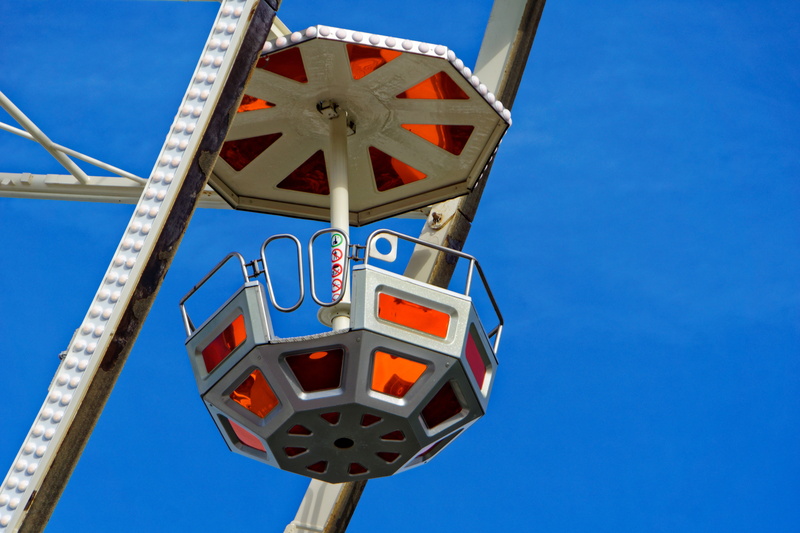 shape, low angle view, rides, hustle and bustle, carousel, gondola, folk festival, sign, high, day, no people, blue, carnies, leisure activity, kettenkarussel