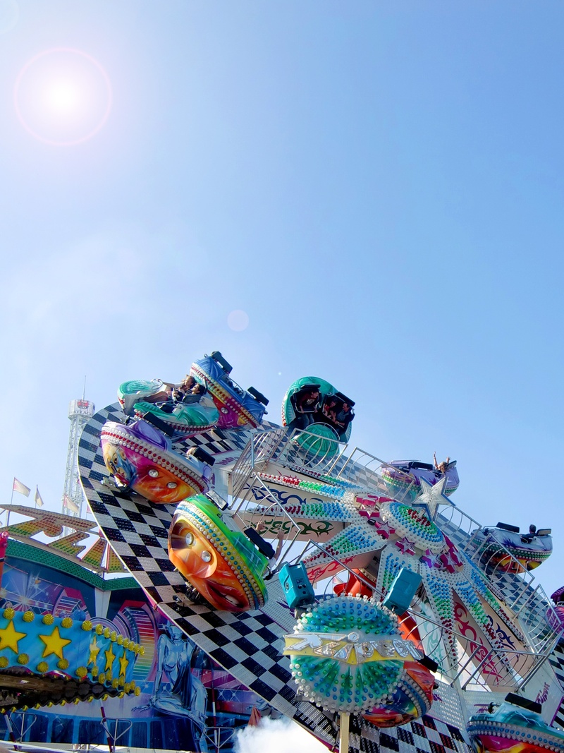 day, year market, carnival, hustle and bustle, amusement park ride, city, arts culture and entertainment, outdoors, decoration, clear sky, art and craft