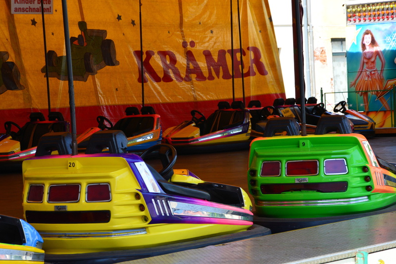 land vehicle, women, bus, public transportation, building exterior, pleasure, nautical vessel, bumper cars, travel, carnies, architecture, text, built structure