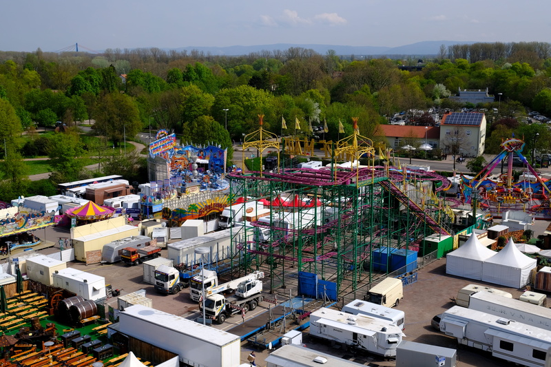arts culture and entertainment, building exterior, nature, folk festival, roller coaster, carousel, year market, buden, outdoors, fair, city, crowd, architecture