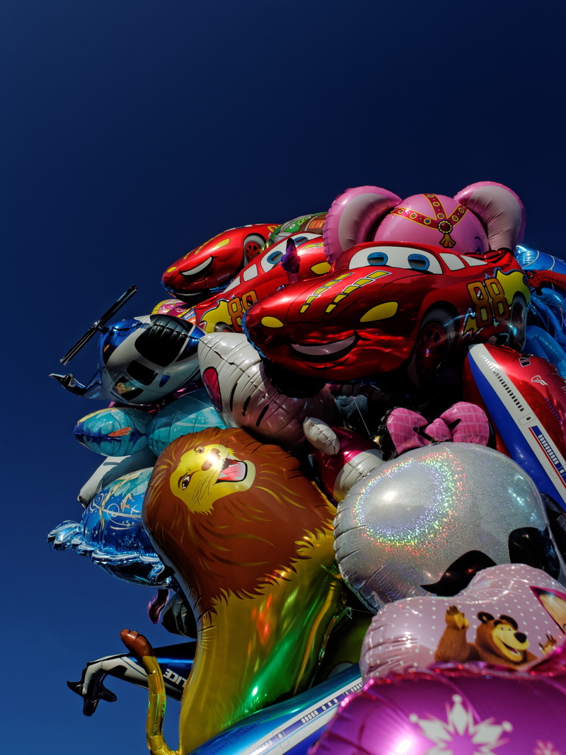 low angle view, festival, figurine, outdoors, human representation, day, carousel, inflatable, representation, bremen, no people, clear sky, creativity