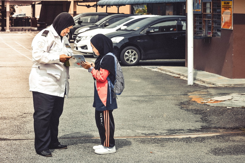 land vehicle, two people, malaysia, child, city, casual clothing, hormat, full length, road, people, men, mode of transportation, motor vehicle, togetherness